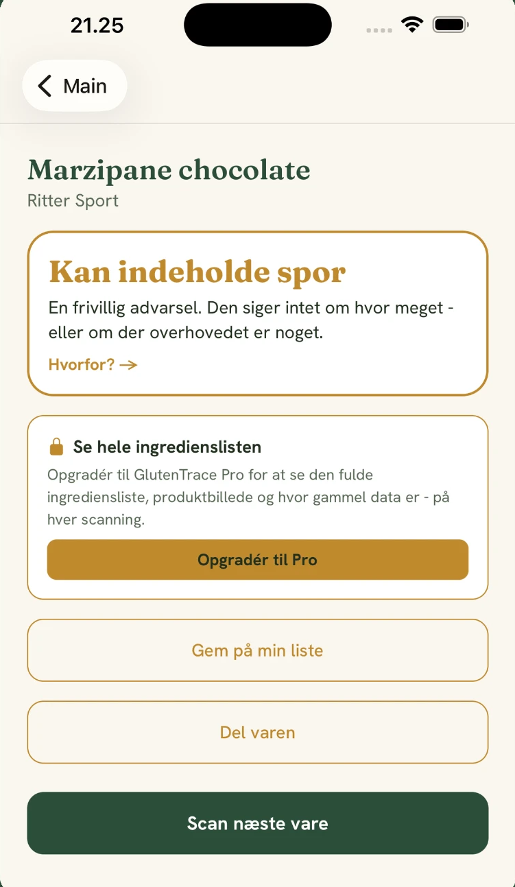 Et GlutenTrace-resultat for Ritter Sport med teksten "Kan indeholde spor" og en forklaring af den frivillige advarsel